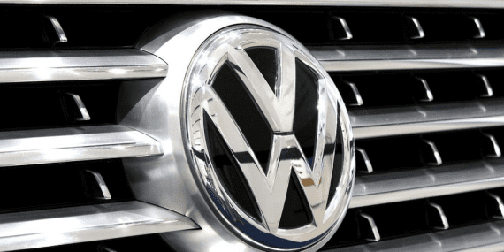 Closeup of a Volkswagen symbol on a cars front grille